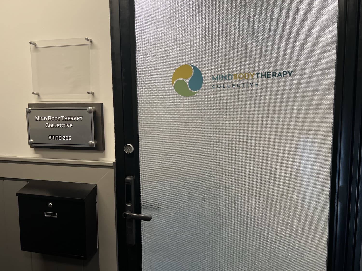 The Mind Body Therapy Collective entrance door, Suite 206